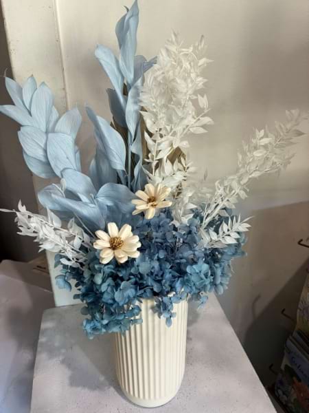 Blue and white preserved arrangement